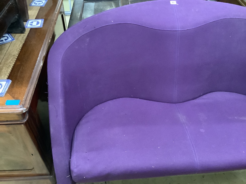 A contemporary purple fabric two seater settee, width 133cm depth 70cm height 87cm